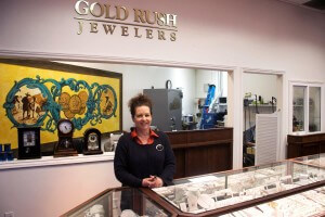 Woman standing smiling at Gold Rush Jewelers in Novato, CA