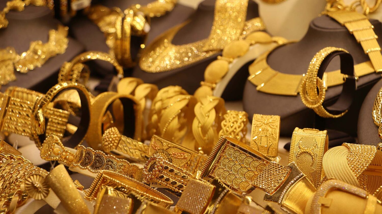 pile of gold jewelry, sell gold, buy gold